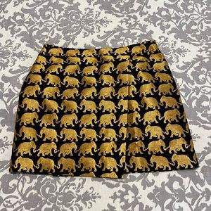 J Crew, print mini skirt. Size 4. Black and gold elephants.